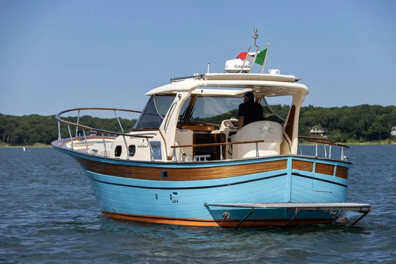  Yacht Photos Pics 2022 Fratelli Aprea 32 Hard Top boat on water, featuring elegant design and vibrant blue hull.