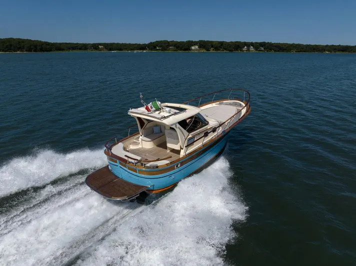  Yacht Photos Pics Fratelli Aprea 32 Hard Top 2022 cruising on open water, rear view.