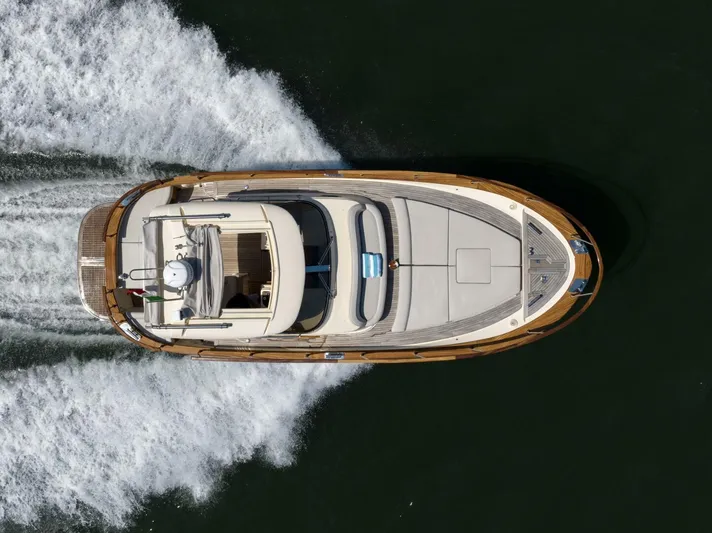  Yacht Photos Pics 2022 Fratelli Aprea 32 Hard Top yacht cruising on water, aerial view.