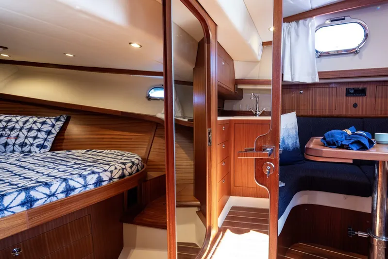  Yacht Photos Pics Luxurious interior of 2022 Fratelli Aprea 32 Hard Top yacht with cozy cabin and seating area.