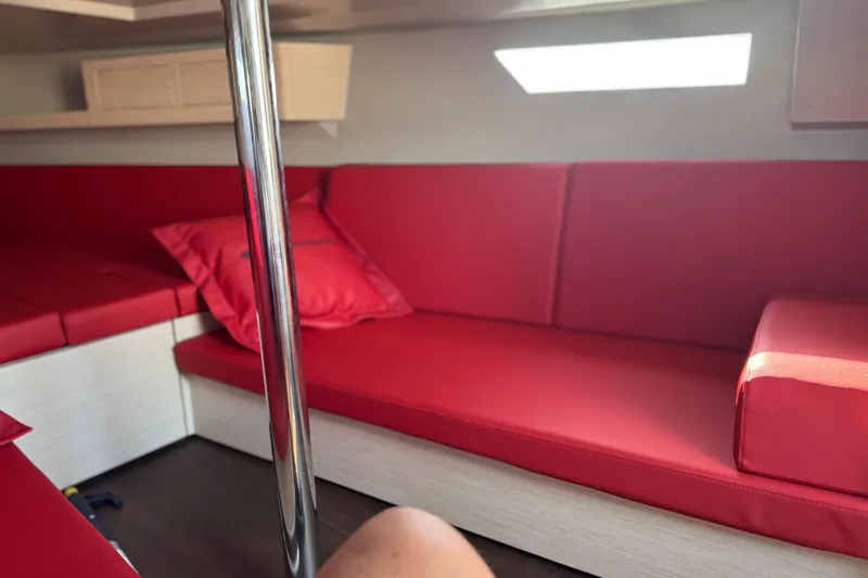 Sortie Yacht Photos Pics Red interior seating of 2023 Saffier 33 Life yacht cabin with natural light.