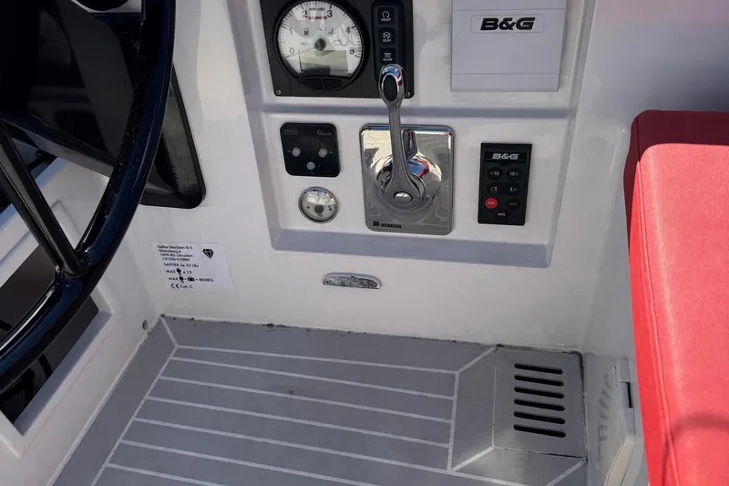 Sortie Yacht Photos Pics Control panel of 2023 Saffier 33 Life yacht with steering wheel and navigation instruments.