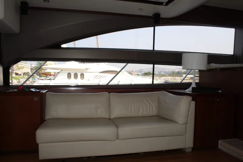  Yacht Photos Pics Interior of a 2013 Princess 64 yacht with white sofa.