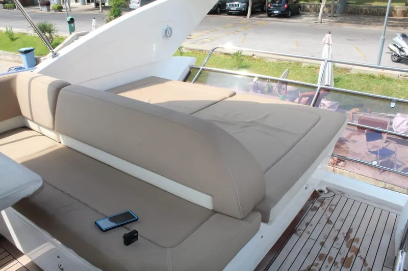  Yacht Photos Pics Sun deck of 2013 Princess 64 yacht with beige cushions.