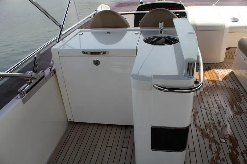  Yacht Photos Pics 2013 Princess 64 yacht deck with seating and sink.