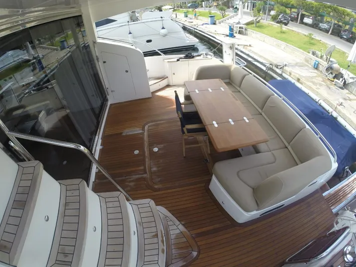  Yacht Photos Pics 2013 Princess 64 yacht deck with seating and table.