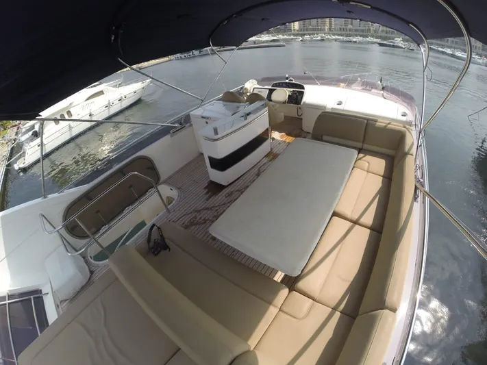  Yacht Photos Pics 2013 Princess 64 yacht interior with seating and table.