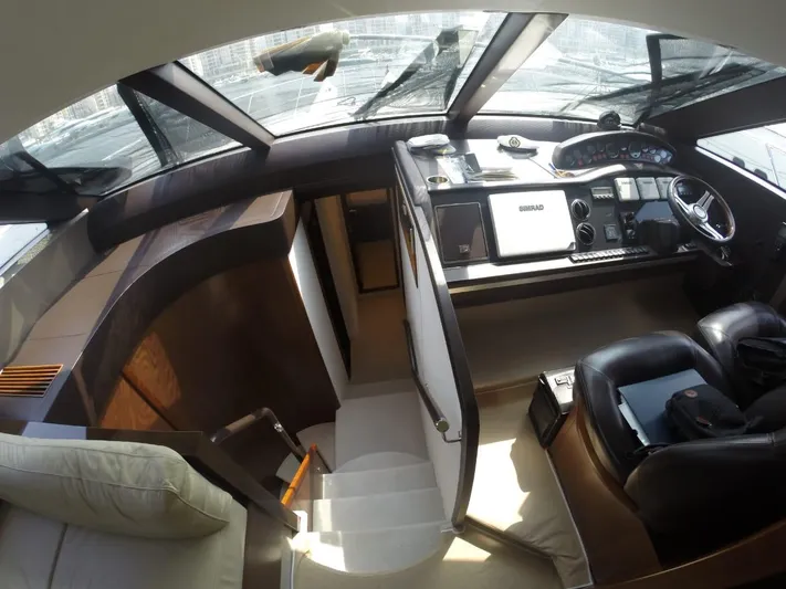  Yacht Photos Pics Interior of a 2013 Princess 64 yacht with modern helm.