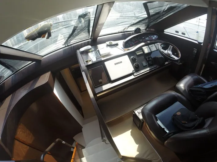  Yacht Photos Pics Interior view of a 2013 Princess 64 yacht helm station.