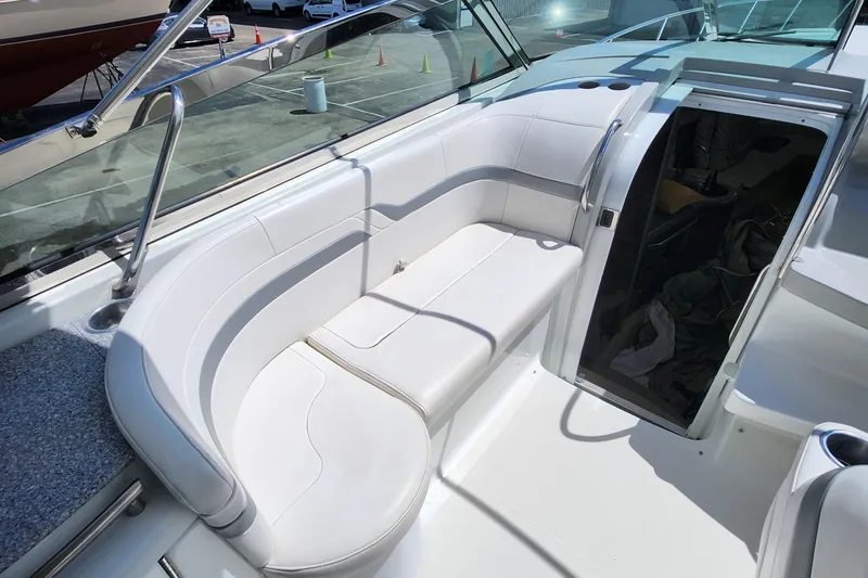 Reduced! Yacht Photos Pics 2005 Formula 400 Super Sport boat with white seating and open cabin door.