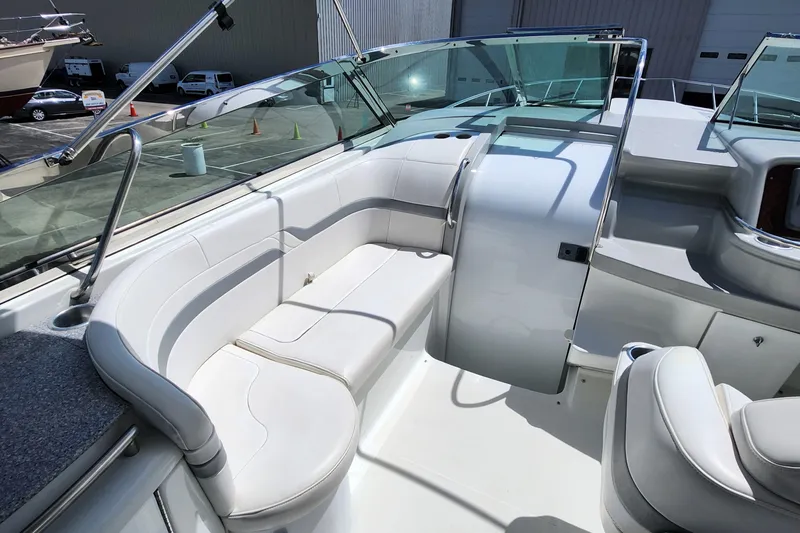 Reduced! Yacht Photos Pics 2005 Formula 400 Super Sport boat interior with white seating and glass windshield.