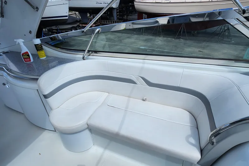 Reduced! Yacht Photos Pics 2005 Formula 400 Super Sport boat interior with white seating and cleaning supplies.