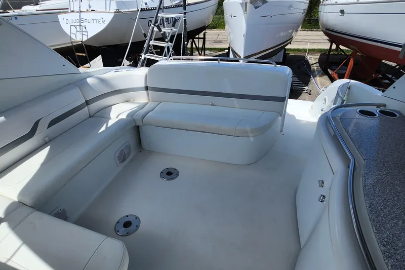 Reduced! Yacht Photos Pics 2005 Formula 400 Super Sport boat interior with white seating and cup holders.