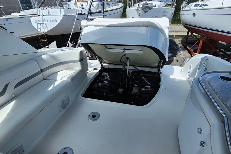 Reduced! Yacht Photos Pics 2005 Formula 400 Super Sport boat engine compartment with open hatch, showcasing dual engines.