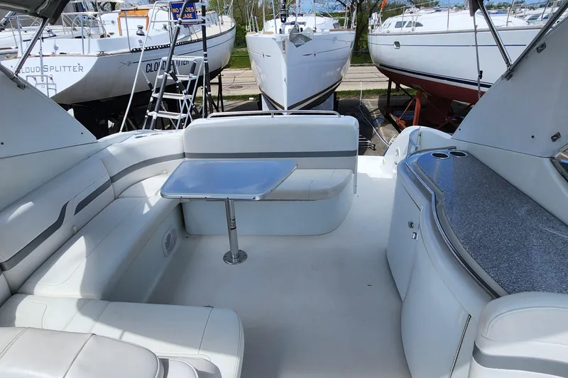 Reduced! Yacht Photos Pics 2005 Formula 400 Super Sport yacht interior with seating and table.