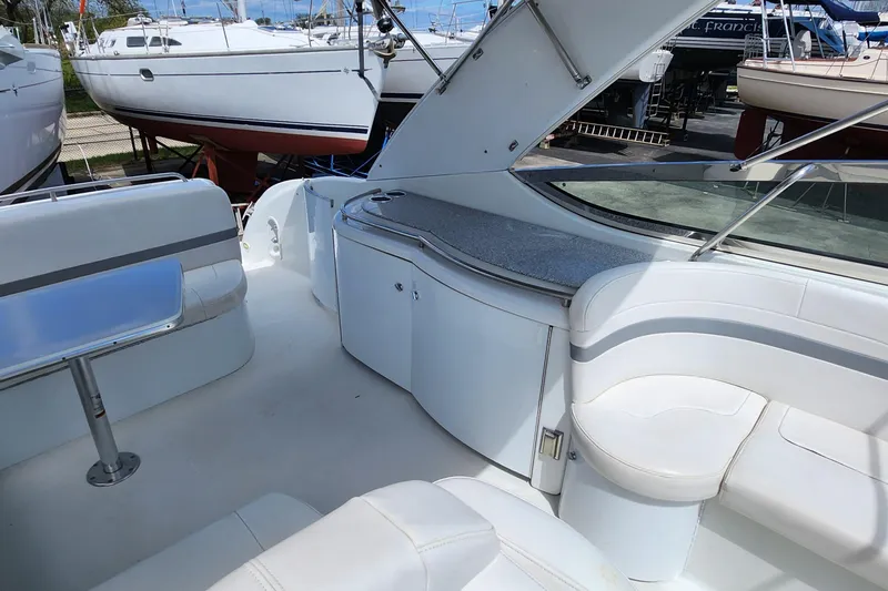 Reduced! Yacht Photos Pics 2005 Formula 400 Super Sport boat interior with white seating and sleek design.
