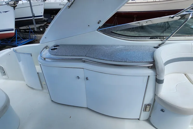 Reduced! Yacht Photos Pics 2005 Formula 400 Super Sport yacht interior with sleek white cabinetry and seating.