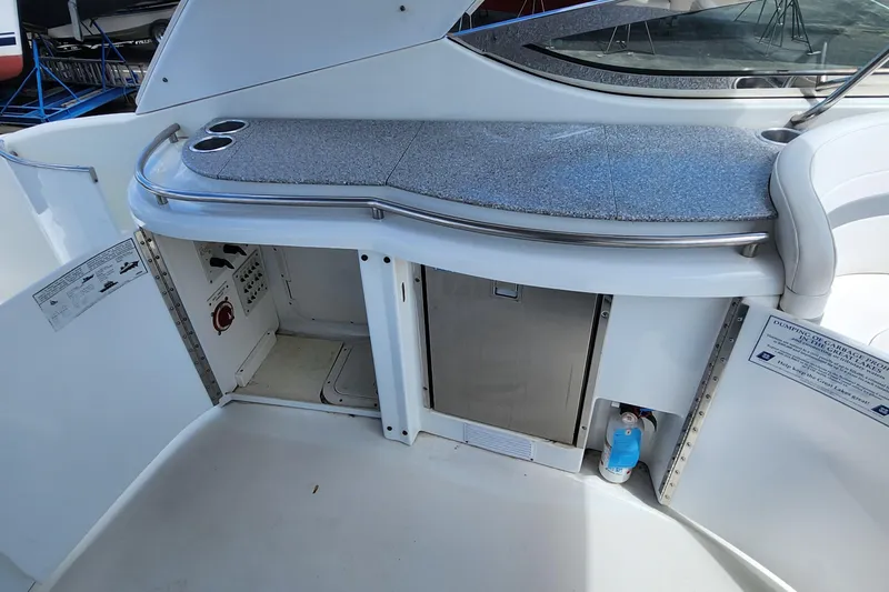 Reduced! Yacht Photos Pics 2005 Formula 400 Super Sport yacht interior with kitchenette and storage compartments.