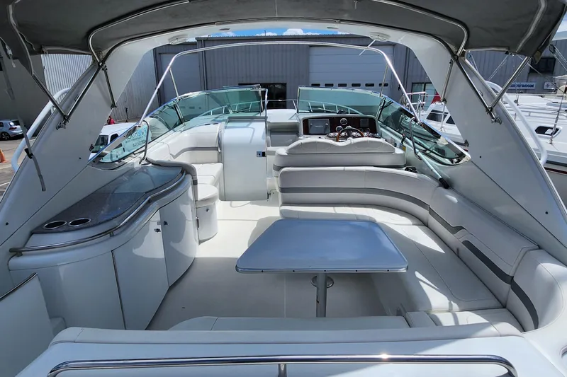 Reduced! Yacht Photos Pics 2005 Formula 400 Super Sport yacht interior with seating and table.