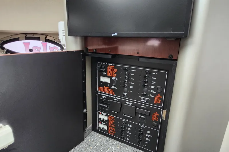 Reduced! Yacht Photos Pics Control panel inside a 2005 Formula 400 Super Sport boat, featuring various switches and displays.