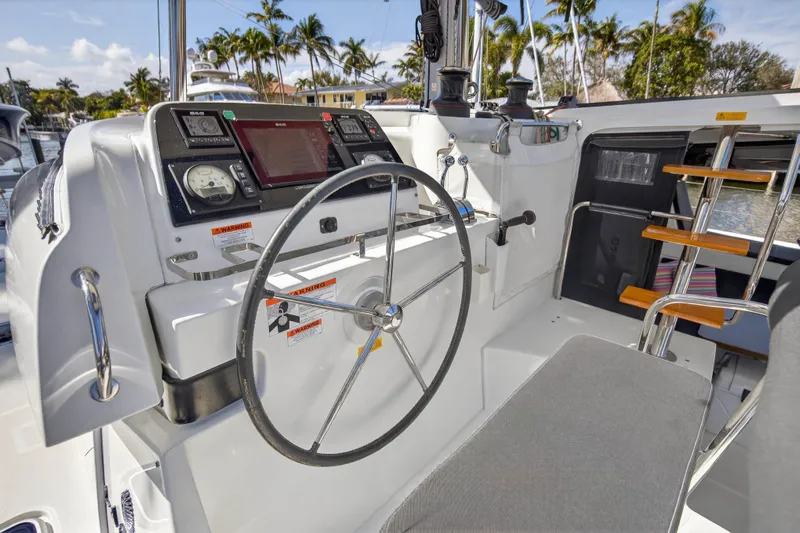 Seaquinn Yacht Photos Pics Helm of 2019 Lagoon 42 catamaran with navigation controls and steering wheel.