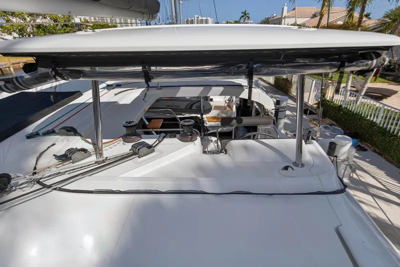 Seaquinn Yacht Photos Pics 2019 Lagoon 42 catamaran deck with rigging and equipment, docked in a sunny marina.