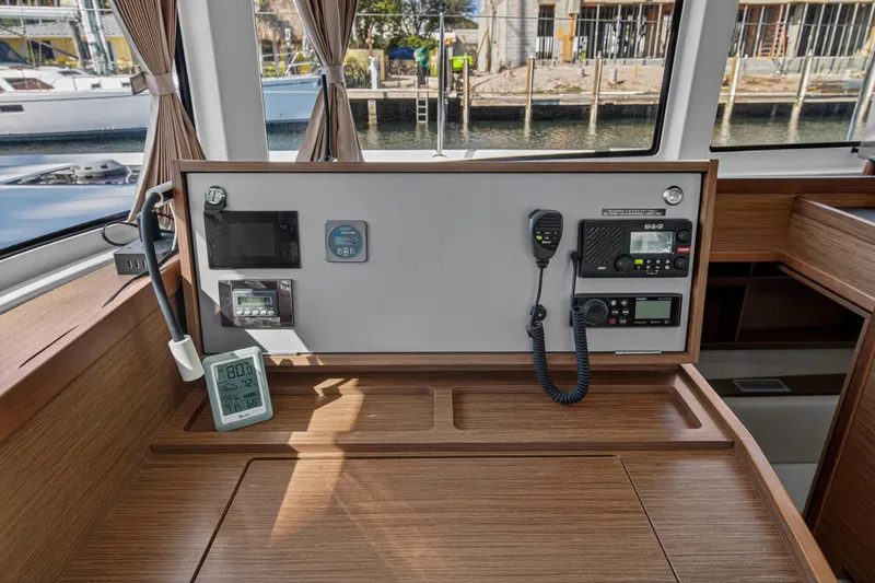Seaquinn Yacht Photos Pics Interior view of 2019 Lagoon 42 yacht's navigation station with control panel and instruments.