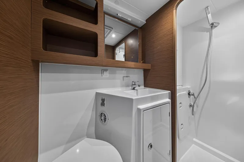 Seaquinn Yacht Photos Pics Modern bathroom in 2019 Lagoon 42 yacht with sleek wood accents and compact design.