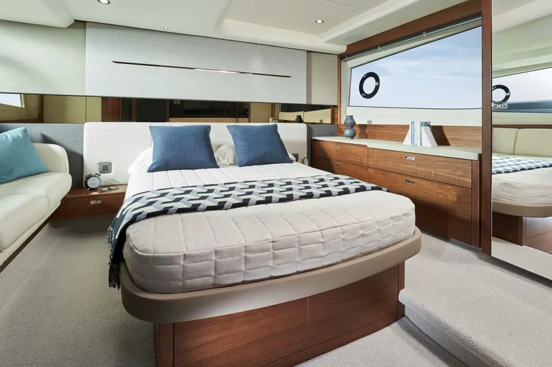 Princess V50 Yacht Photos Pics Luxurious 2024 Princess V50 yacht bedroom with modern decor and elegant furnishings.