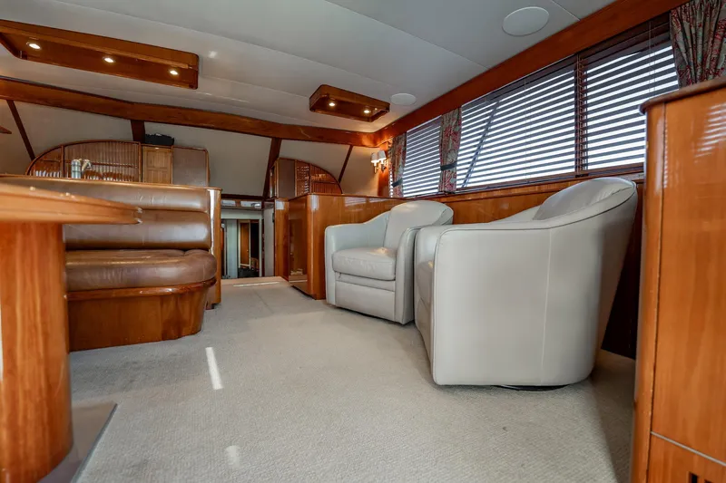 Lucky Yacht Photos Pics Luxurious interior of 1983 Rybovich 55 Convertible yacht with leather seating and wood accents.