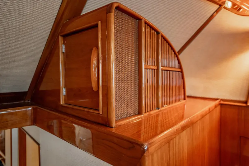 Lucky Yacht Photos Pics Interior of 1983 Rybovich 55 Convertible yacht with polished wooden cabinetry.