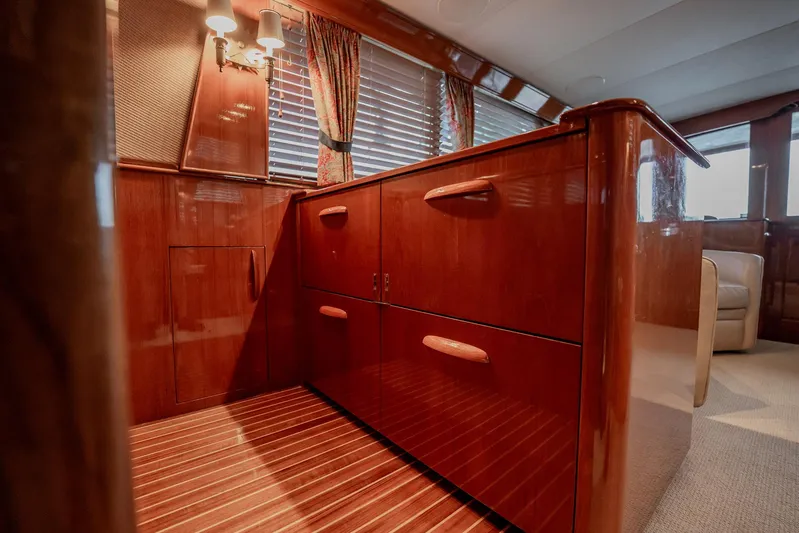 Lucky Yacht Photos Pics Luxurious wooden interior of 1983 Rybovich 55 Convertible yacht with elegant cabinetry.
