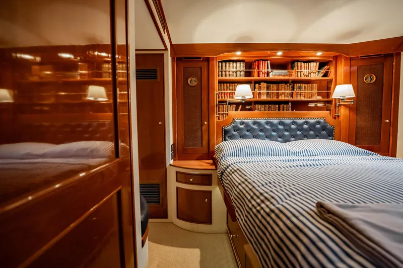 Lucky Yacht Photos Pics Luxurious cabin interior of 1983 Rybovich 55 Convertible yacht with elegant wood finish.