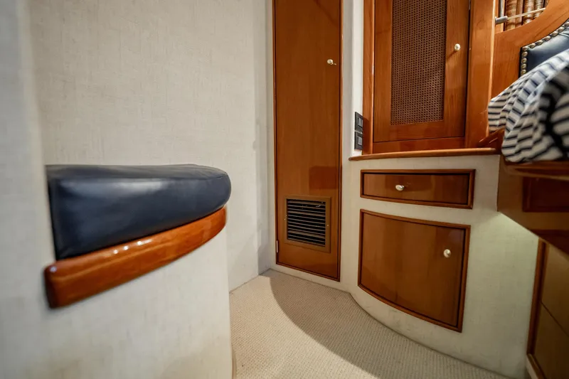 Lucky Yacht Photos Pics Interior of 1983 Rybovich 55 Convertible yacht with wooden cabinetry and seating.