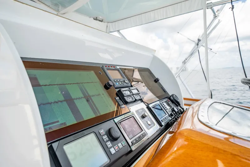 Lucky Yacht Photos Pics Control panel of 1983 Rybovich 55 Convertible yacht with navigation equipment.