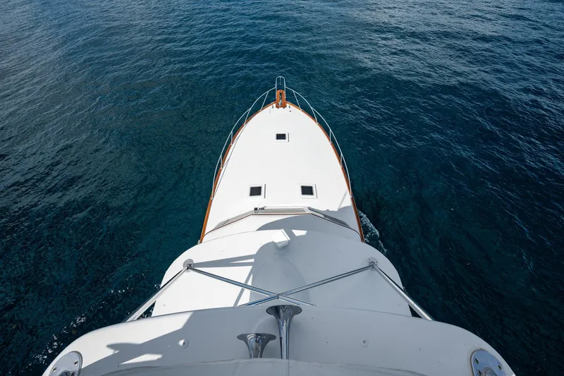 Lucky Yacht Photos Pics Aerial view of 1983 Rybovich 55 Convertible yacht cruising on open water.