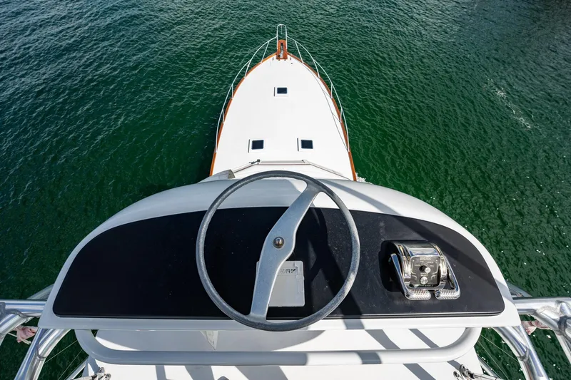 Lucky Yacht Photos Pics Helm view of 1983 Rybovich 55 Convertible yacht on open water.