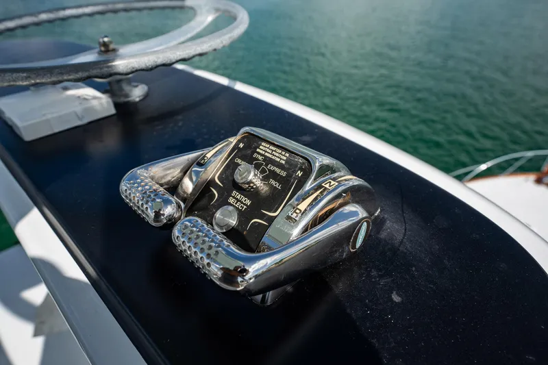 Lucky Yacht Photos Pics Close-up of 1983 Rybovich 55 Convertible yacht controls with steering wheel.
