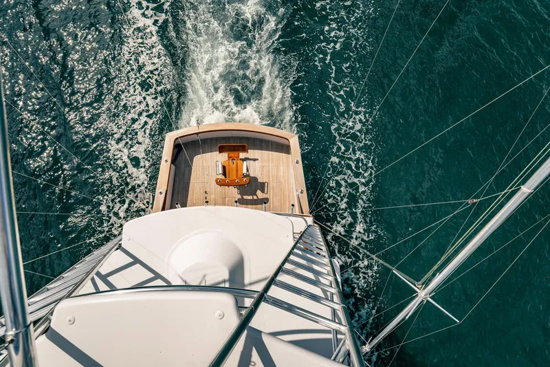 Lucky Yacht Photos Pics Aerial view of 1983 Rybovich 55 Convertible yacht cruising on open water.