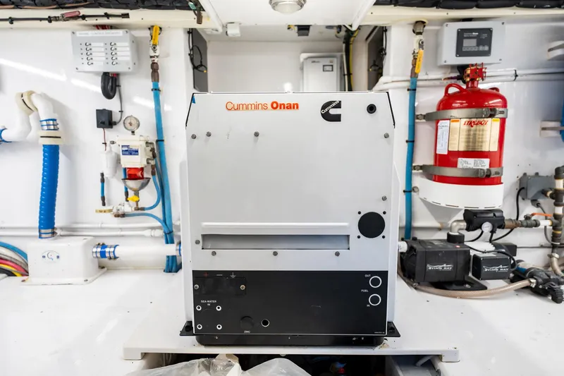 Lucky Yacht Photos Pics Engine room of 1983 Rybovich 55 Convertible with Cummins Onan generator.