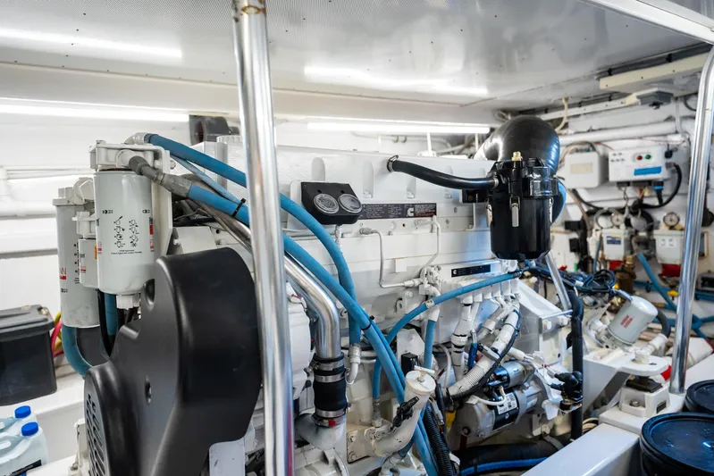 Lucky Yacht Photos Pics Engine room of 1983 Rybovich 55 Convertible yacht, showcasing detailed machinery and components.