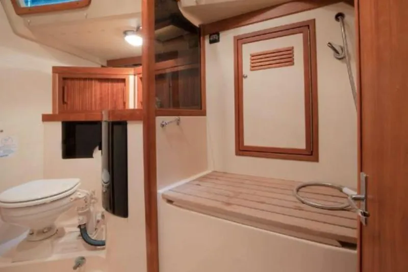 Blue Sky Yacht Photos Pics Interior of 2000 Sabre 402 yacht bathroom with wooden accents and shower area.