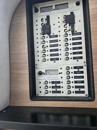  Yacht Photos Pics Electrical panel on a 2008 Donzi 38 ZSF boat, featuring labeled switches and meters.