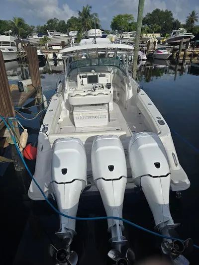  Yacht Photos Pics 2008 Donzi 38 ZSF boat with triple outboard engines docked at marina.