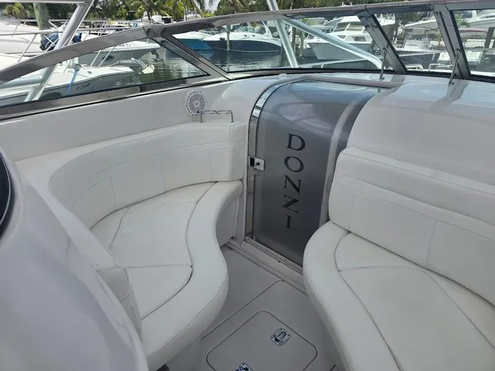  Yacht Photos Pics 2008 Donzi 38 ZSF boat interior with white seating and branded door.