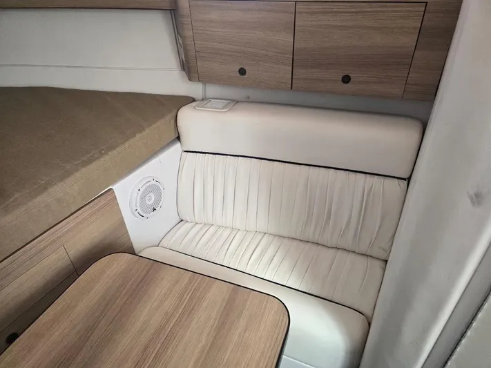  Yacht Photos Pics Interior of 2008 Donzi 38 ZSF boat with wood cabinets and white seating.