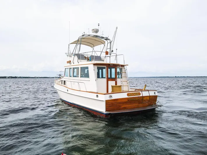 Mystic Yacht Photos Pics 1989 Grand Banks 36 Sedan boat on open water, showcasing classic design and craftsmanship.