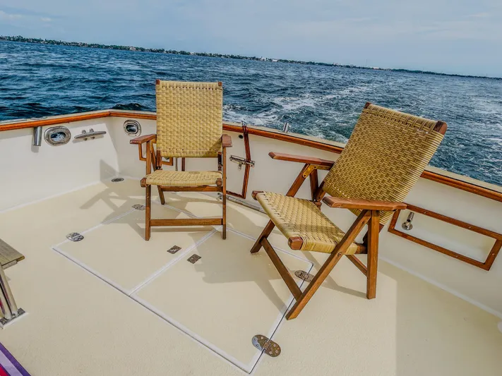 Mystic Yacht Photos Pics 1989 Grand Banks 36 Sedan deck with two wicker chairs, ocean view.