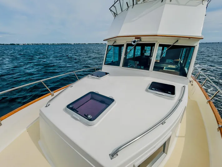 Mystic Yacht Photos Pics 1989 Grand Banks 36 Sedan yacht on open water, showcasing deck and cabin windows.