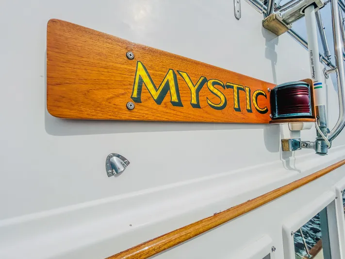 Mystic Yacht Photos Pics 1989 Grand Banks 36 Sedan boat with "Mystic" nameplate and navigation light.